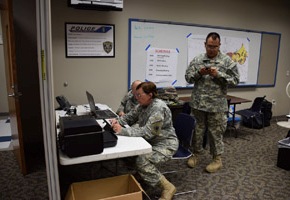 Staff Sgt. William Wiley, Staff Sgt. Brenda Newton, and Spc. Desmon Dunn from the 39th Composite Regiment, Texas State Guard provide administrative support to the Disaster District Coordinators from the Texas Department of Emergency Management during the flood emergency operations in Wichita Falls, Texas, May 23, 2015.  The assistance of the soldiers to the emergency contributed to the ability first responders to rescue, evacuate, and provide emergency services to local residents.  (Texas State Guard photo by 39th Regiment/ Released)